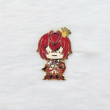 Decorative pin with red hair, crown, and heart design on a white background